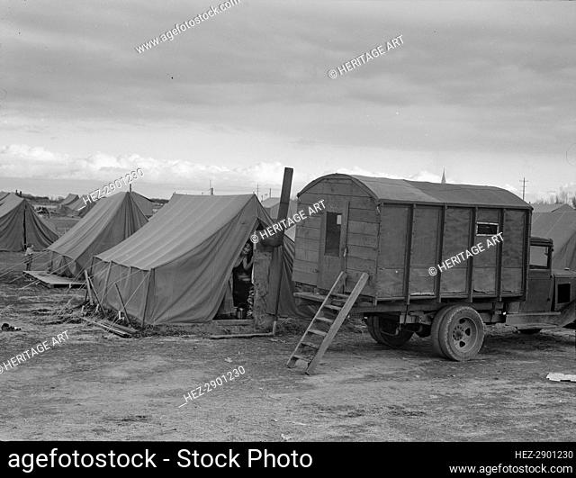 In mobile camp at end of season, cold day, FSA camp, Merrill, Klamath County, Oregon, 1939. Creator: Dorothea Lange