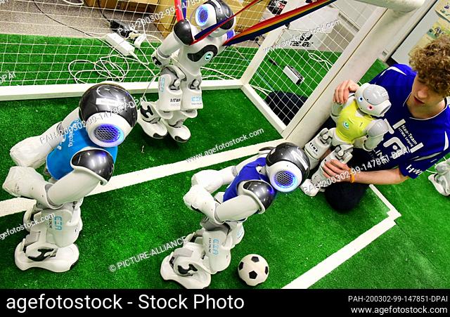 20 February 2020, Saxony, Leipzig: In the robot laboratory of the Nao-Team of the University of Applied Sciences (HTWK) student Felix Loos checks the test game...