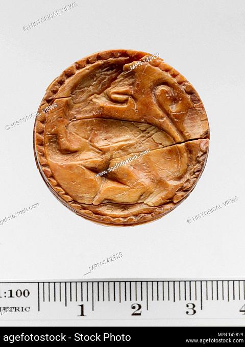 Ivory discoid seal. Period: Geometric; Date: early 7th century B.C; Culture: Greek; Medium: Ivory; Dimensions: L. 3.3 cm; Classification: Gems