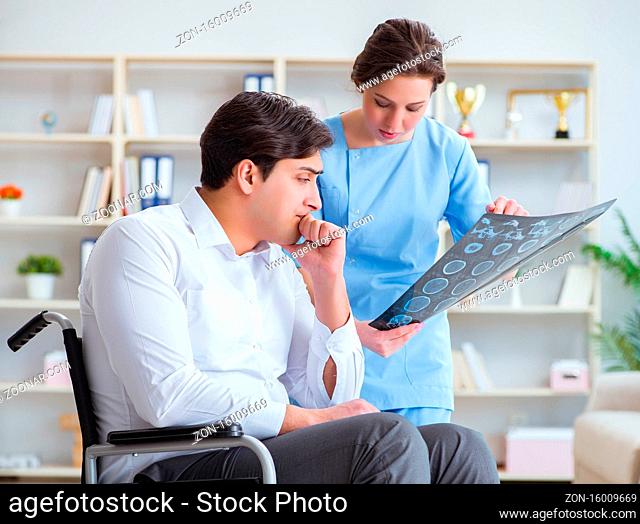 The doctor discussing x-ray image with patient