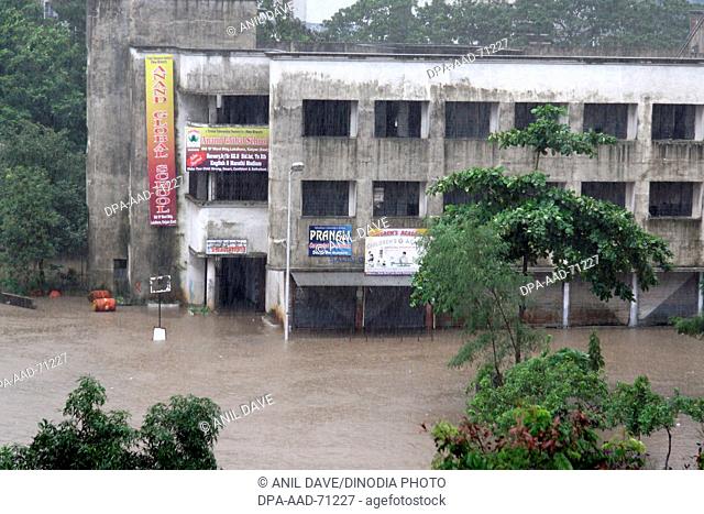 showing Ward zone of Kalyan - Dombivali building with flooded water with rain , Monsoon , world record rain in Kalyan, Bombay now Mumbai , Maharashtra , India