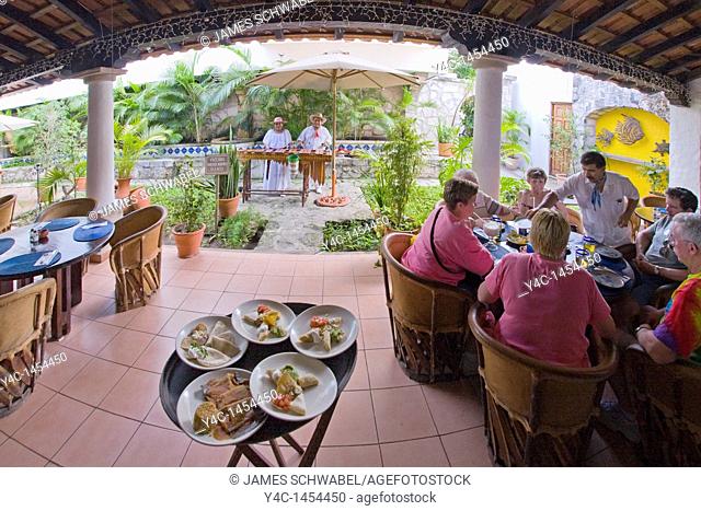 Plates of food on stand in restaurant in San Miguel, Cozumel, Mexico