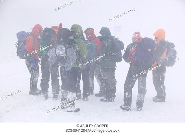 Mountaineers surviving atrocious conditions on Cairngorm Scotland UK