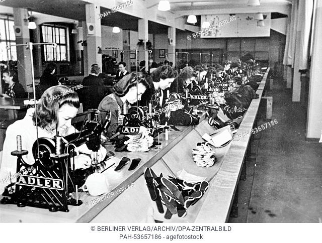 The Nazi propaganda photo shows women sitting at sewing machines of the brand ""Adler"", working at the production of uniforms in February 1943