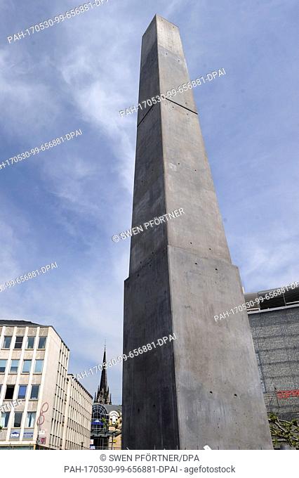 FILE - File picture dated 23 May 2017 showing the finished documenta piece, a 16-meter tall obelisk, by US artist Olu Oguibe exhibitted at the King's Square in...