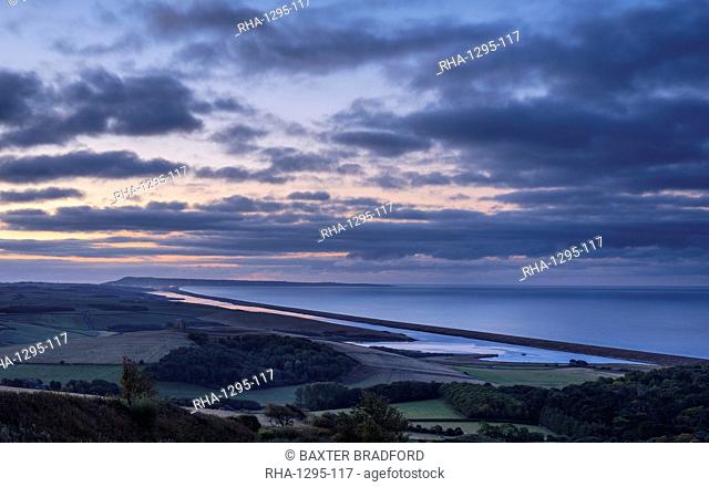 Portland, the sweep of Chesil Beach, the inland lagoon the Fleet seen from the hill at Abbotsbury, near Weymouth, Dorset, England, United Kingdom, Europe