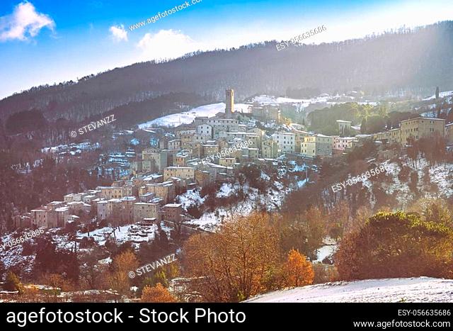 Snow in Tuscany, winter panorama at sunset. Castelnuovo Val di Cecina village. Pisa, Italy Europe