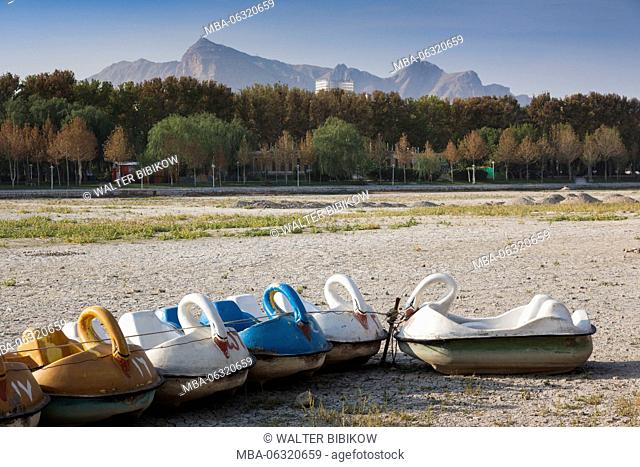 Iran, Central Iran, Esfahan, swan boats on dried out riverbed of the Zayandeh River