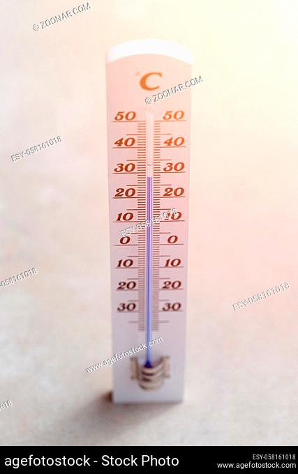 Thermometer close up picture in summer time, concrete floor