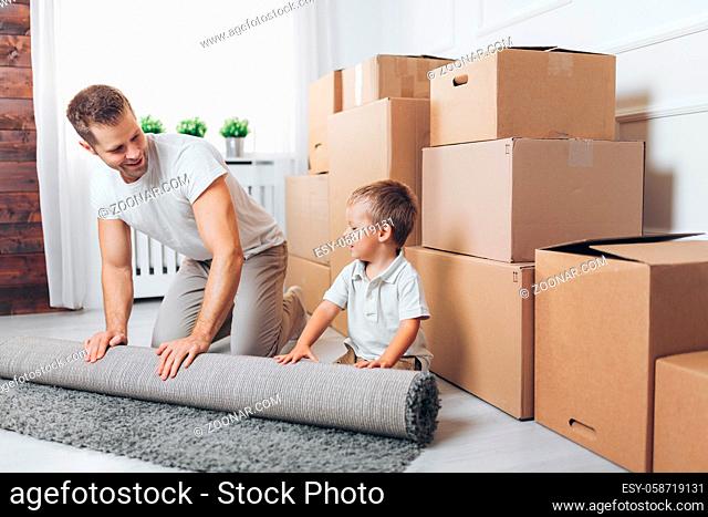 Moving concept, Father and his son moving into their new home