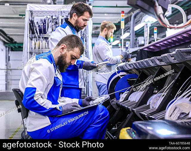 RUSSIA, MOSCOW - JULY 25, 2023: A team of research and development engineers of a project for production of anti-lock braking systems (ABS) and electronic...