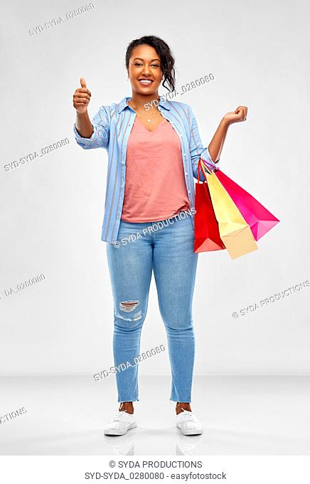 happy african american woman with shopping bags