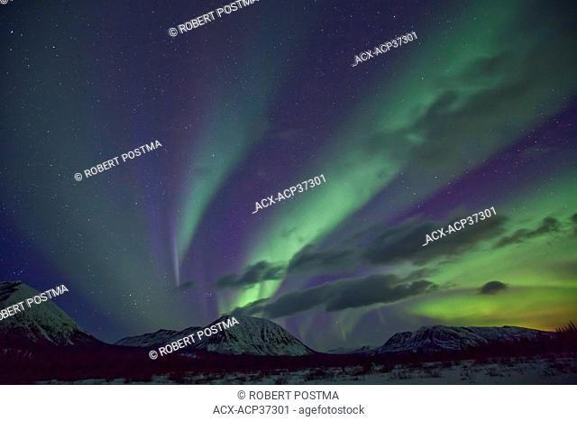 Aurora borealis or northern lights above the mountains outside of Whitehorse, Yukon Territory, Canada