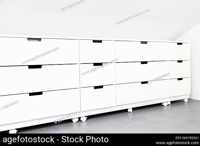 Modern Drawer cabinet with plenty of storage space in a room of a house. Copy space