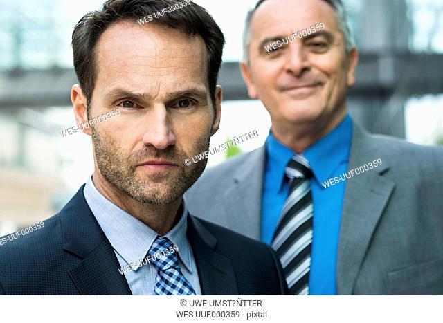 Portrait of two businessmen outdoors