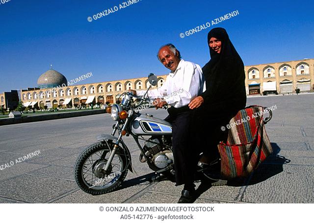 Couple on motorbike. Sheikh Lotfollah mosque. Iman Khomeiny square. Isfahan. Iran