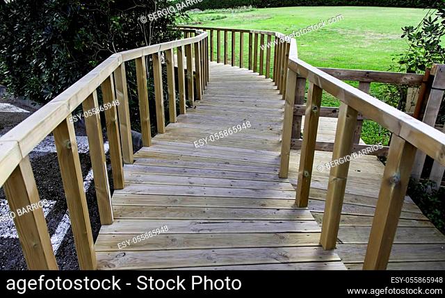 Wooden path to the beach, access detail for person, summer and vacations
