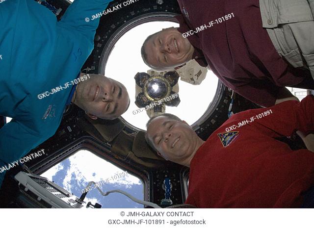 NASA astronaut Kevin Ford (lower right), Expedition 34 commander; along with Russian cosmonauts Evgeny Tarelkin (left) and Oleg Novitskiy, both flight engineers