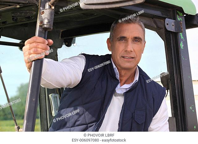 Farmer sat in his tractor