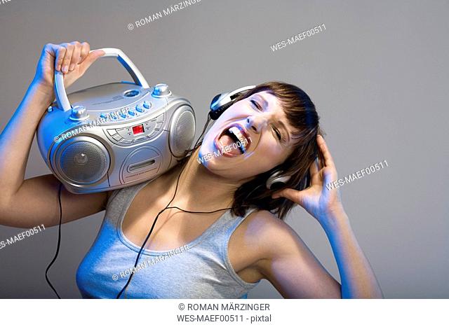 Woman listening to music, close-up