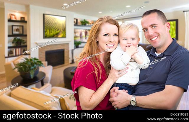 Happy young military family inside their beautiful living room