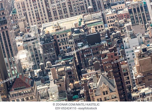 New York City, USA. Midtown Manhattan building rooftops with steam comming from the heating systems