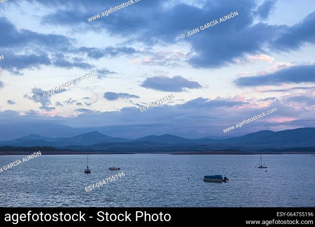 Leisure boats anchored on the shore of the Gabriel y Galan reservoir, Caceres, Spain. Active tourism at freshwaters coasts concept