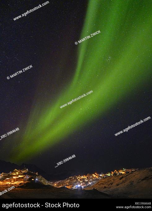 Northern Lights over the town. Town Tasiilaq (formerly called Ammassalik), the biggest town in East Greenland. America, Greenland, Tasiilaq, danish territory