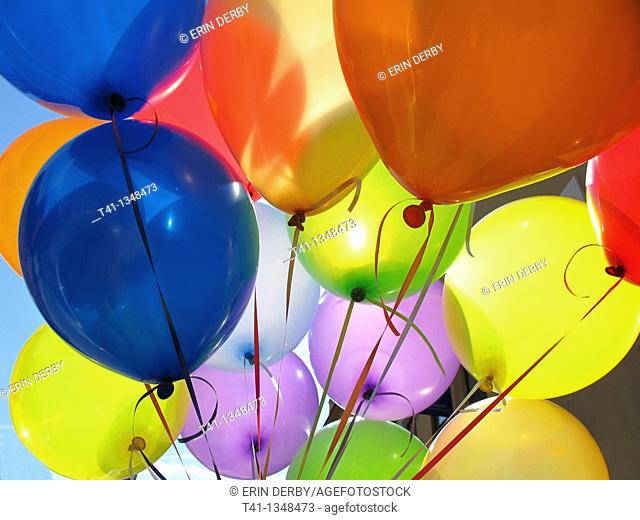 A bunch of colorful birthday balloons