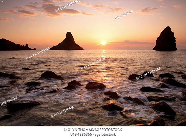 Sunrise at Aci Trezza with the Cyclops Rocks Isole dei Cyclopi clearly visible, Sicily, Italy