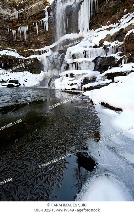 Uldale Falls frozen over in winter. Baugh Fell in the Howgills, Cumbria, UK. (Photo by: Wayne Hutchinson/Farm Images/UIG)