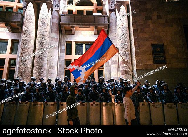ARMENIA, YEREVAN - SEPTEMBER 22, 2023: Riot police officers guard the Armenian Government Building during a protest. The protesters demand the resignation of...