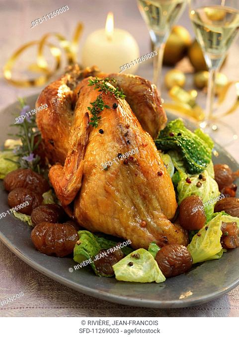 Roast guinea fowl with savoy cabbage and chestnuts for Christmas dinner