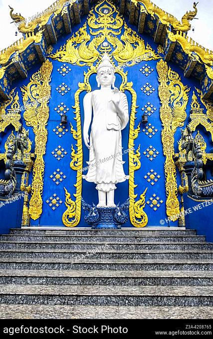 White Buddha at the Blue Temple (Wat Rong Suea Ten or Temple of the Dancing Tiger) in Chiang Rai, Thailand, Asia. Blue is symbolically associated with purity
