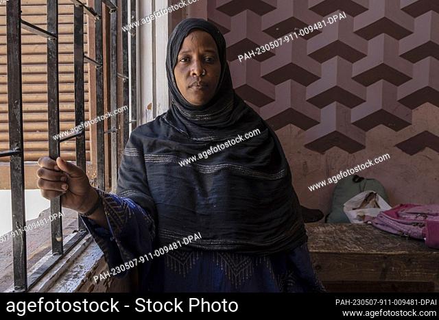 04 May 2023, Egypt, 6th of October City: A picture made available on 8 May 2023 shows Sudanese Naglaa Al-Aazz, 34, posing for a photo at the Union of Refugee...