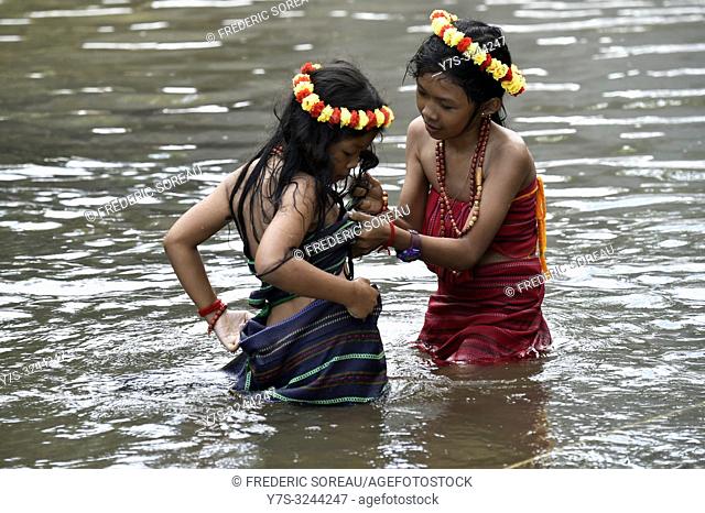 Two young girls wearing flower garland on head in Bou Sra waterfall near Sen Monorom, Mondolkiri province, Cambodia, South east Asia