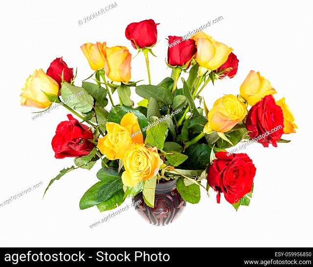 bouquet of fresh red and yellow rose flowers in ceramic vase isolated on white background