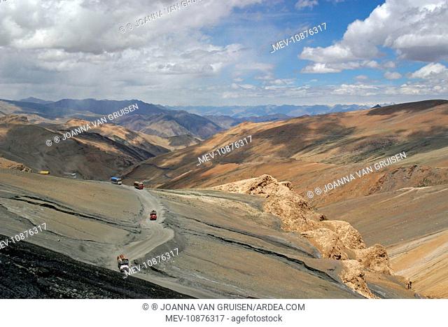 Trucks descending from Taglang La (5359m pass on Manali Leh road). Ladakh India North side