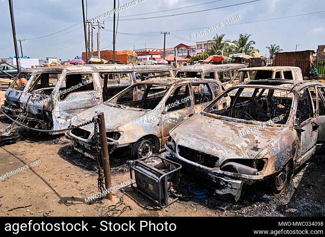 Damaged vehicles are seen at a site following an explosion after a tanker carrying fuel crashed at Kara Bridge along the Lagos-Ibadan highway