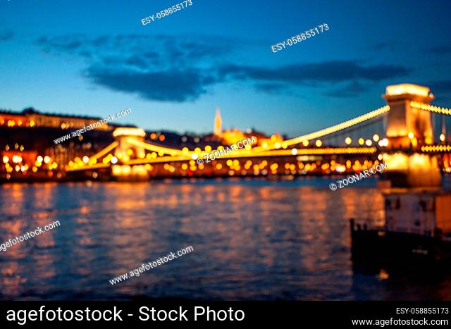Blurred Budapest chain bridge on danube river. Famous sights at landmark Buda riverbank. Hungary