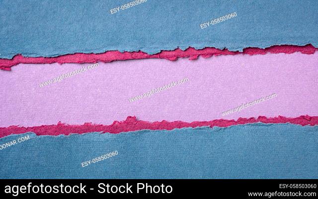 paper abstract in blue, pink and purple with a copy space - sheets of handmade cotton rag paper, blank web banner