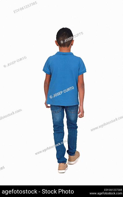 rear view of boy walking on white background