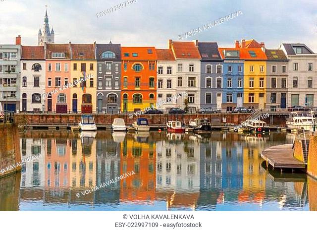 River Leie, colored houses and Belfry tower in Ghent, Belgium