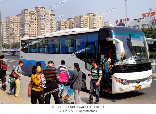China, Beijing, Chaoyang District, Panjiayuan, motor coach, bus, Asian, man, woman, exiting,