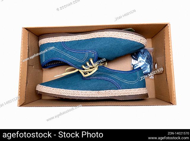 Part of pair blue man shoe with shoelace in box. Isolated on white