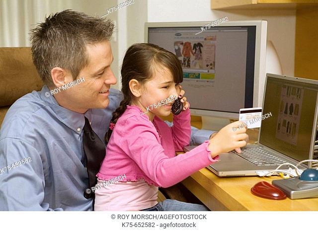 Dad and daughter shopping online