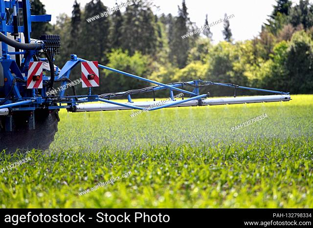 A farmer applies the phytosanitary glyphosate on a field, spraying, spraying, spraying, tractor, spraying whitewash, weed killing, poison, carcinogenic
