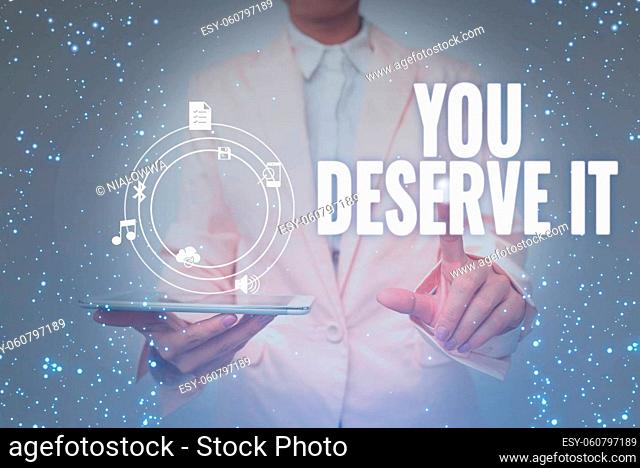 Conceptual caption You Deserve It, Business concept should have it because of their qualities or actions Lady In Uniform Holding Tablet In Hand Virtually...