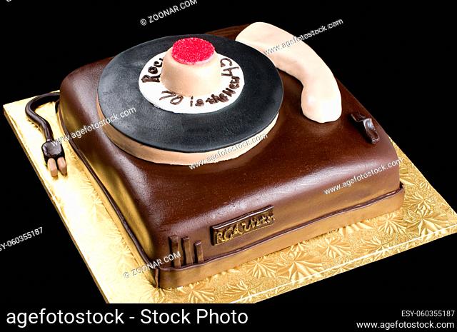 Close up of cake turtable on isolated black background