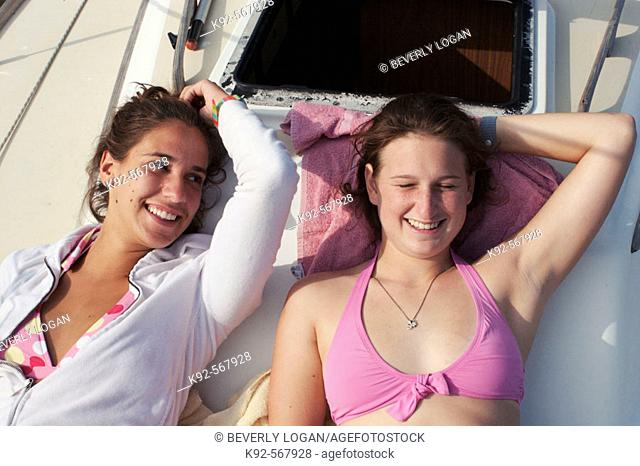 Teenage girls on a sailboat